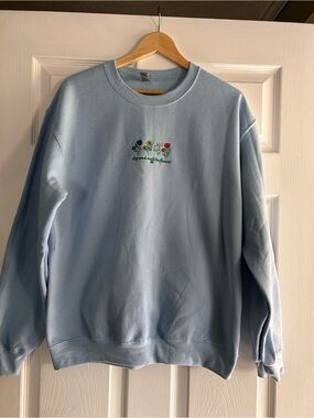 Gildan Light Blue Crewneck Sweatshirt with Embroidered Floral Motif